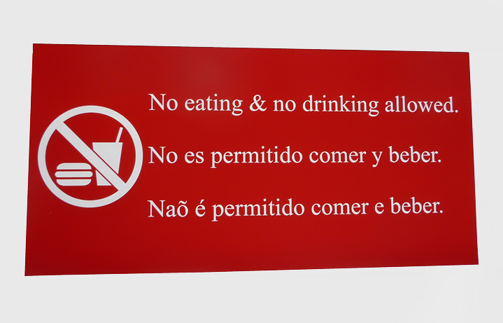 Laser engraved red no food or drink sign in 3 languages measuring 12 in. x 24 in.
