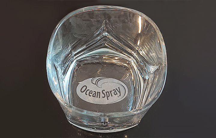 Engraved bottom of a whiskey glass.