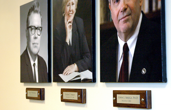 Custom wood plaques for portraits of college presidents